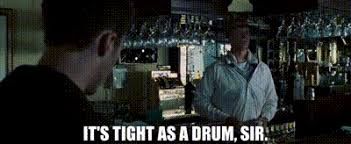 Screenshot from Fight Club with the bartender in a neck brace telling Edward Norton "it's tight as a drum, sir"