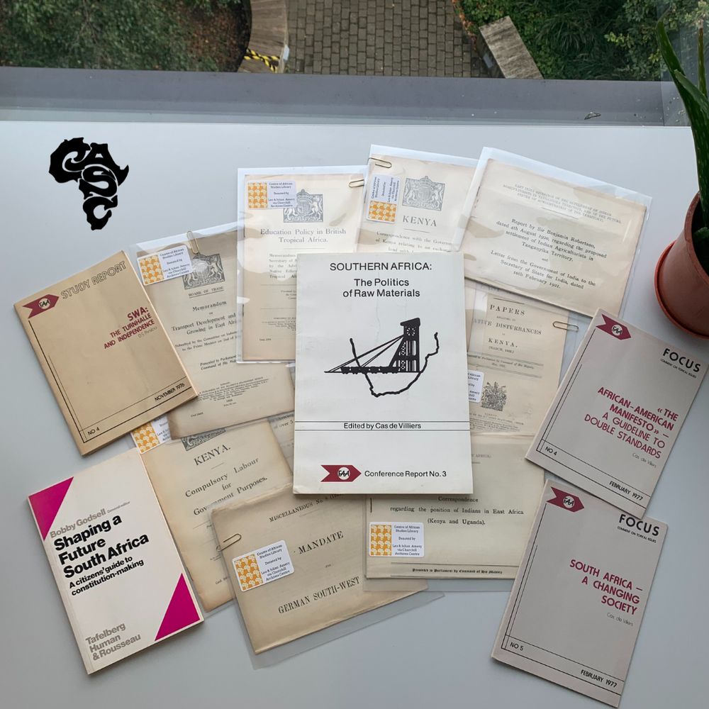 Pamphlets donated by Leo and Julian Amery sprawled out on a desk in the African Studies Library.