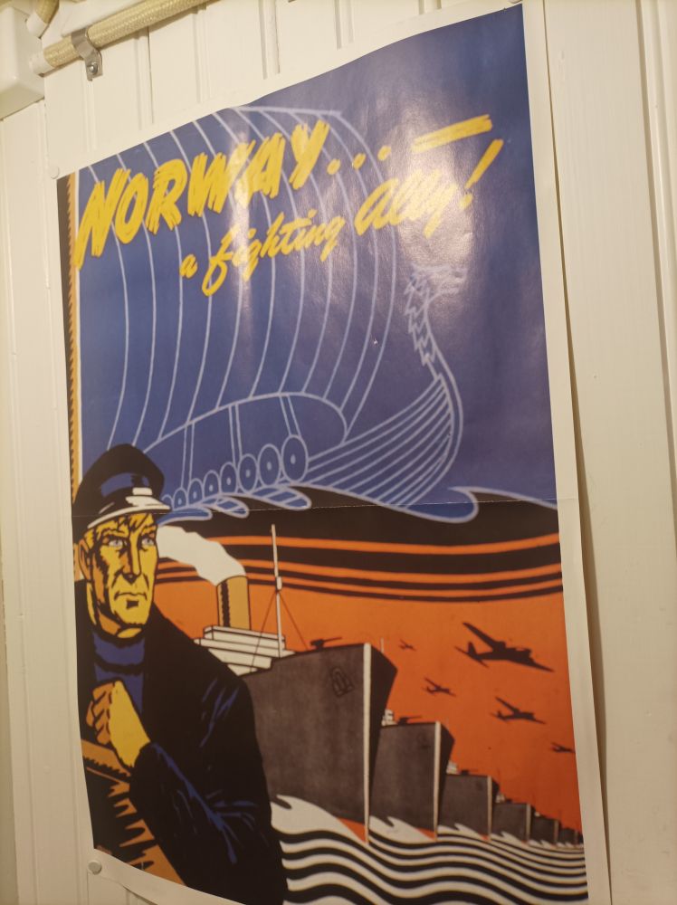 A wartime poster with a rugged sailor next to a line of ships and the caption 'Norway, a fighting ally'