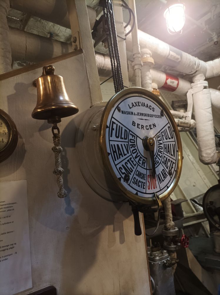 A bell and ship control marked with things like full, half, forward, backward and stop