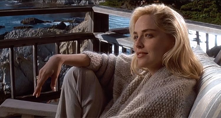 Sharon Stone, seated, looking relaxed and glamorous in a soft wool knit.