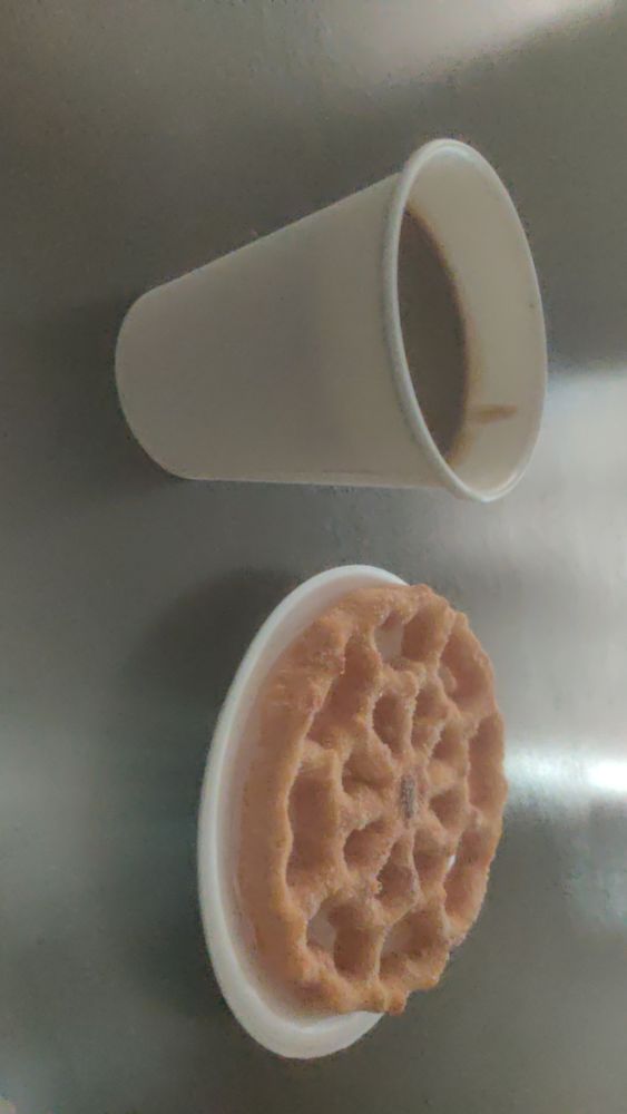 Cup of champurro and buñuelo 