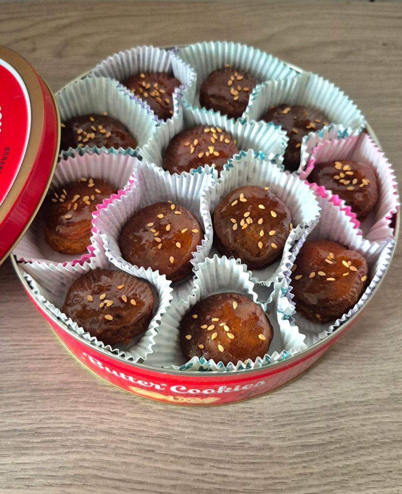 Red tin box of butter cookies filled with homemade yakgwa (Korean honey cookies)