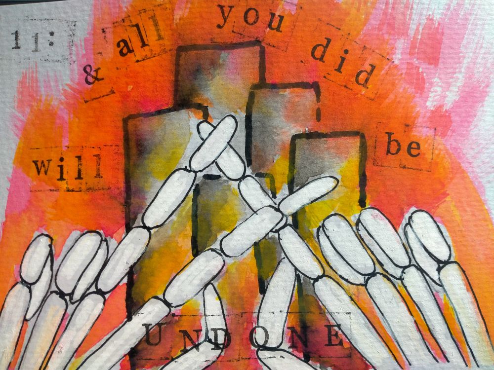 A watercolour, paint pen, marker and stamp artwork, depicting two skeleton hands doing the twenty-one pilots logo often written as l-/. Behind are four grey towers, surrounded by red and yellow fire. The words "and all you did will be undone"  and "11:" are stamped on the picture.