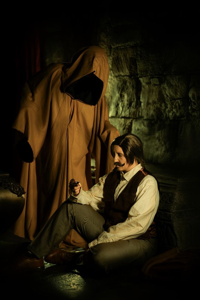 Picture of two cosplayers (John and Arthur of Malevolent Podcast)