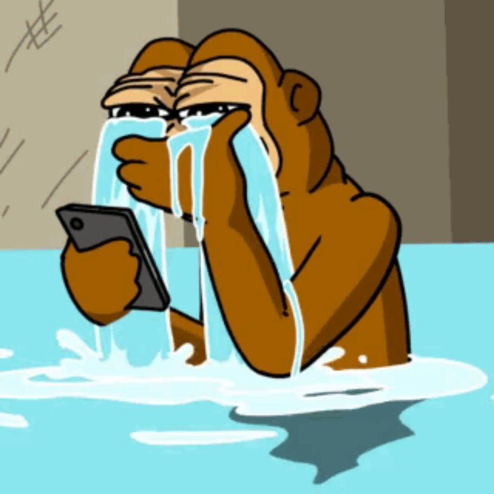 a cartoon monkey is holding a cell phone and crying