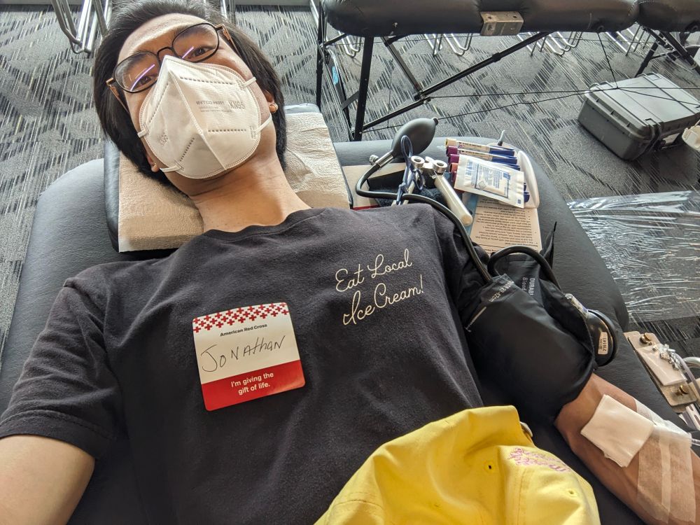 me laying down with a covered needle in my arm 