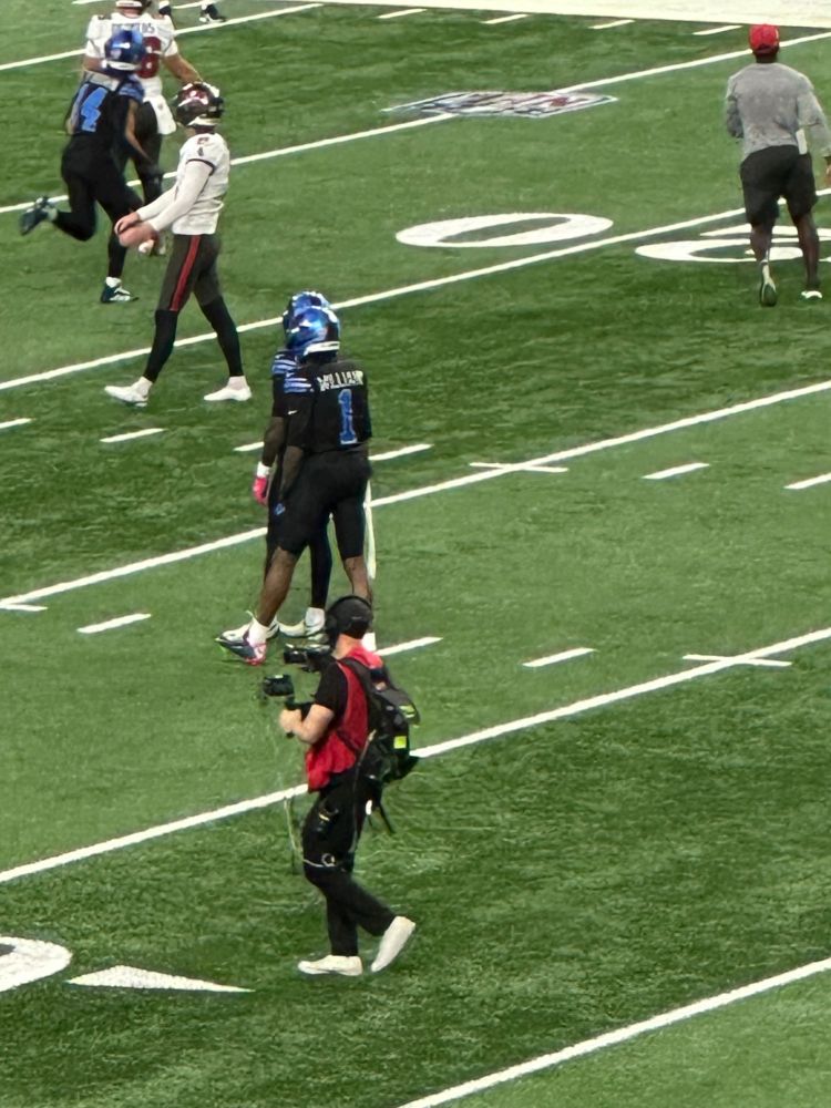 Jameson Williams on the football field at Ford Field.