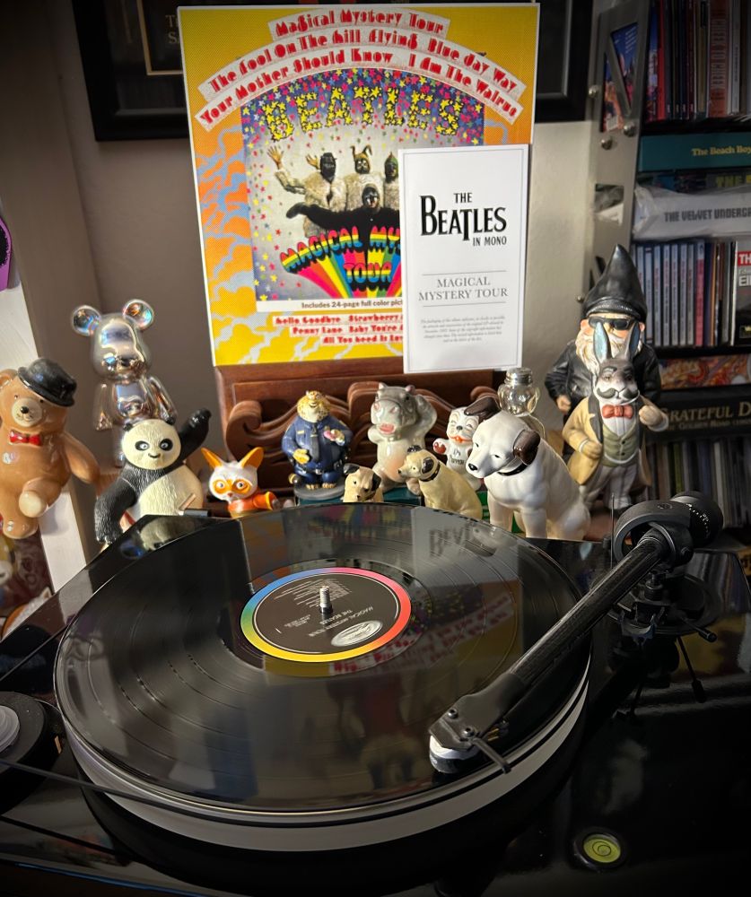 While reading the autobiographies of Beatles producer George Martin and engineer Geoff Emerick back to back, I am revisiting some of their key productions with fresh insights. This is the revelatory new Mono master of Magical Mystery Tour (MMT), a favorite in The Beatles In Mono boxed set. 

For those not in the know, this MMT LP was created for the US market. In the UK it was a 6-song double EP, two "extended play" 45 RPM 7-inch discs in a gatefold sleeve. EPs were not popular in the US so MMT was fleshed out as a full album, adding non-LP singles from the time (all of Side 2). The result is a legitimate follow-on to Sgt. Pepper. 

The US MMT album was unfortunately made from multi-generation dub downs of the tracks so it never sounded as good as it could.  For this version, set producer Giles Martin went back to the original Mono mix tapes -- the preferred versions which The Beatles themselves worked on intensely -- and made a new first generation album master and it sounds spectacular. 

If you like MMT in Stereo, look for the 1973-era German pressing on Apple which somehow ended up being the first version that had true Stereo mixes of many of the tracks (vs. the faked stereo on some of them previously). It sounds wonderful. Has a quite different cover design and is called "Magical Mystery Tour Plus Other Songs."

Do I sound particularly obsessive about this album? Well, MMT was the first Beatle album I ever bought with my own money around 1968 or early 69. It was the first album I ever bought. So, it will always hold a special place in my heart and mind.  

Goo goo ga joob, baby!