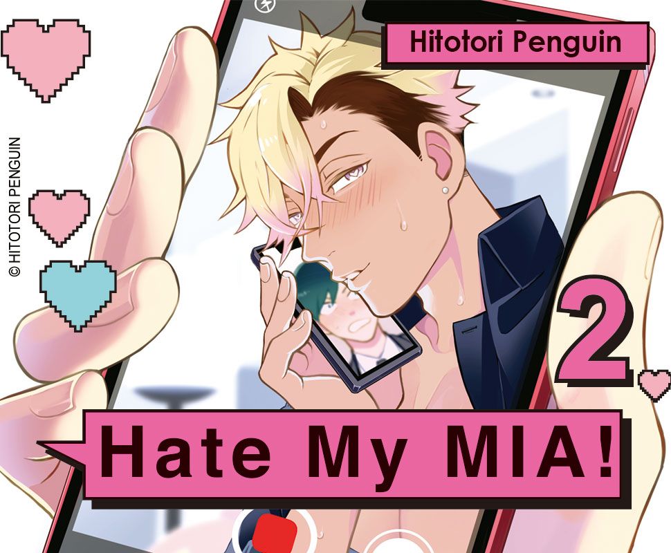 Visuel de la cover du manga japonais du tome 2 de « Hate my Mia » de Hitotori Penguin.
Sur le visuel on peut voir une main tenant un téléphone. Sur l’écran, apparaît un des perso, blond, le visage coquin (il rougit légèrement), tenant contre sa joue un téléphone sur lequel apparaît le second protagoniste.