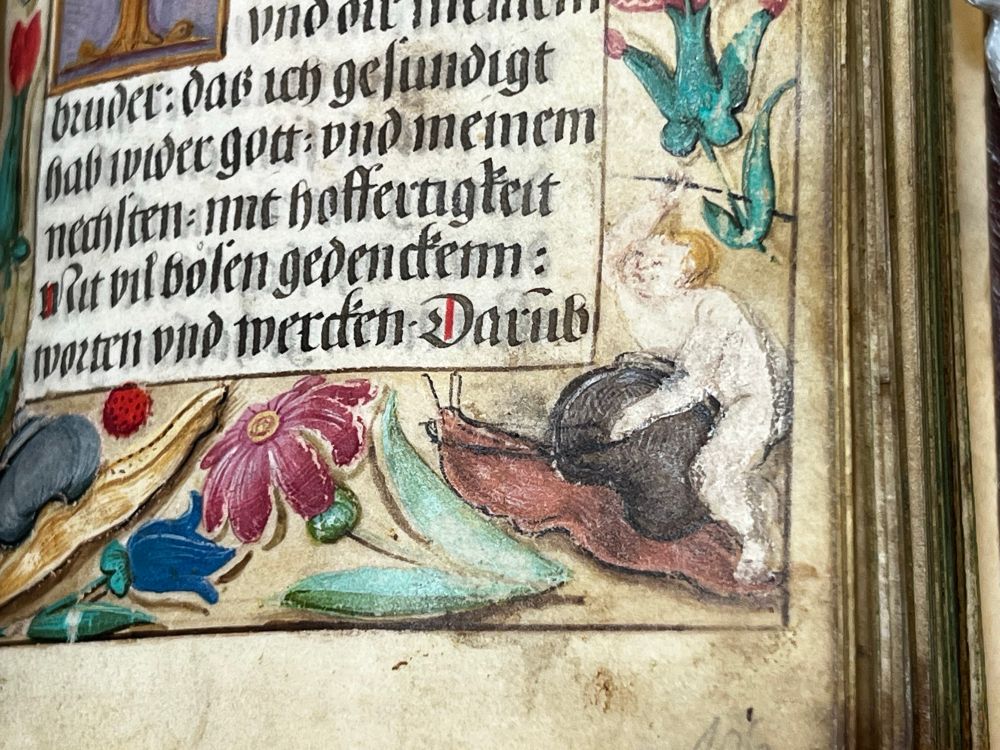 Manuscript picture of child riding a snail