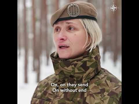 A multinational NATO choir performed Carol of the Bells in snowy Latvia at the border with Russia.