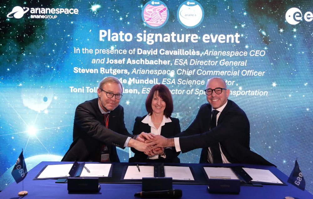 From left, the ESA Director of Space Transportation, Toni Tolker-Nielsen, ESA Director of Science, Carole Mundell, and Arianespace Chief Commercial Officer, Steven Rutgers, shake hands after signing the launch agreement to fly ESA’s scientific mission Plato, at the European Space Conference in Brussels.