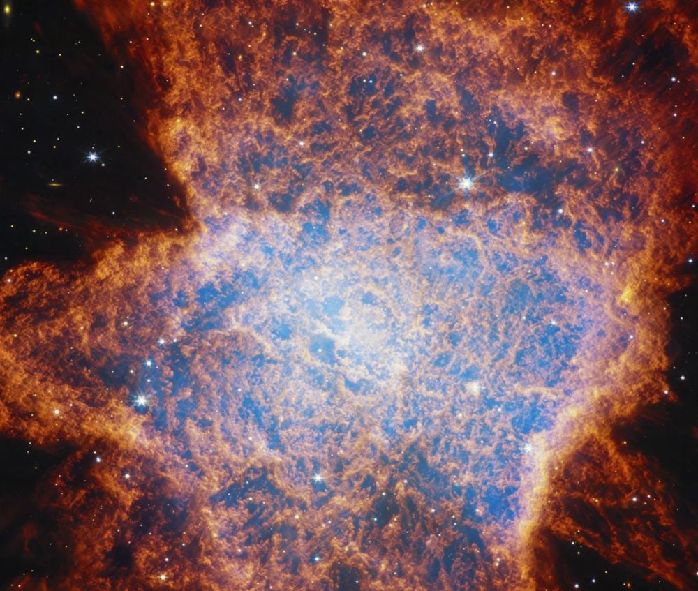 NASA/ESA/CSA James Webb Space Telescope view of planetary nebula NGC 6072 in the near-infrared shows a complex scene of multiple outflows expanding out at different angles from a dying star at the centre of the scene. Red areas represent cool molecular gas, for example, molecular hydrogen.