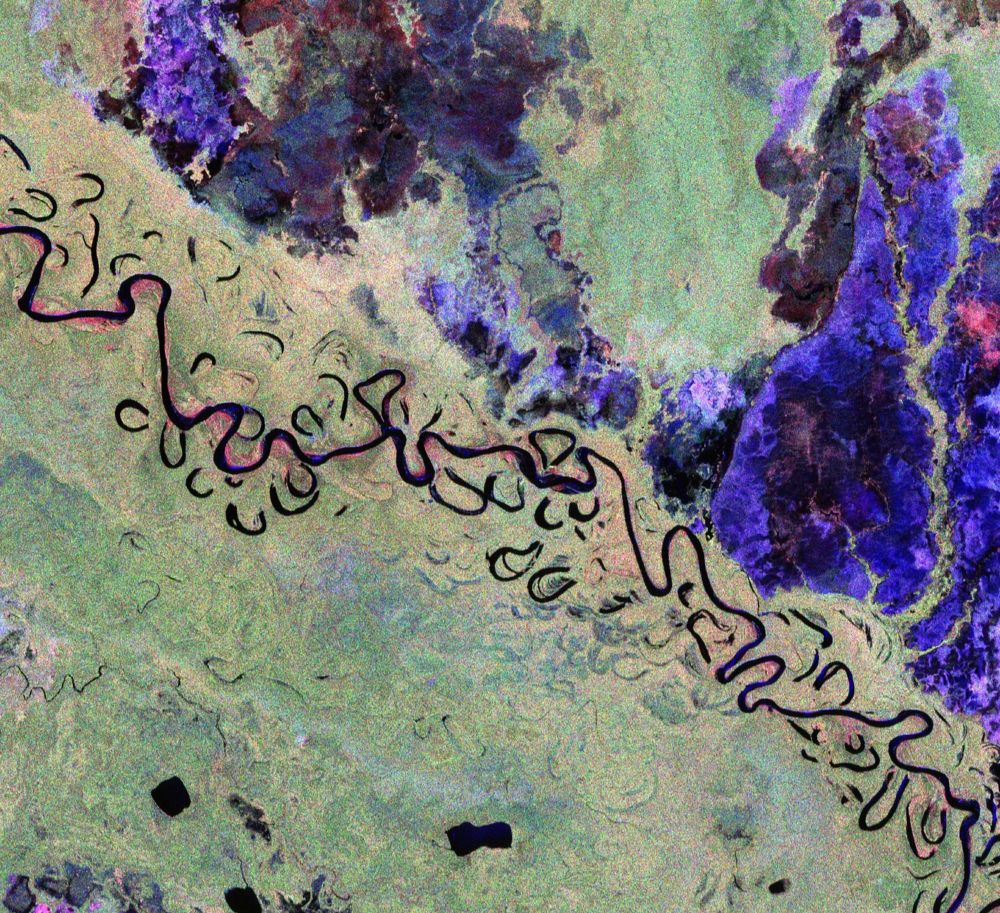 This image features part of Bolivia. This vibrant image was created using the radar instrument’s different polarisation channels, with each colour revealing distinct characteristics of the landscape. For instance, green hues mainly represent rainforest, red hues forested floodplains and wetlands, and blue–purple is indicative of grasslands, while black areas are rivers and lakes. The image spans approximately 90 km along the Biomass satellite's flight path (length) and 60 km across in width, with north oriented to the right.