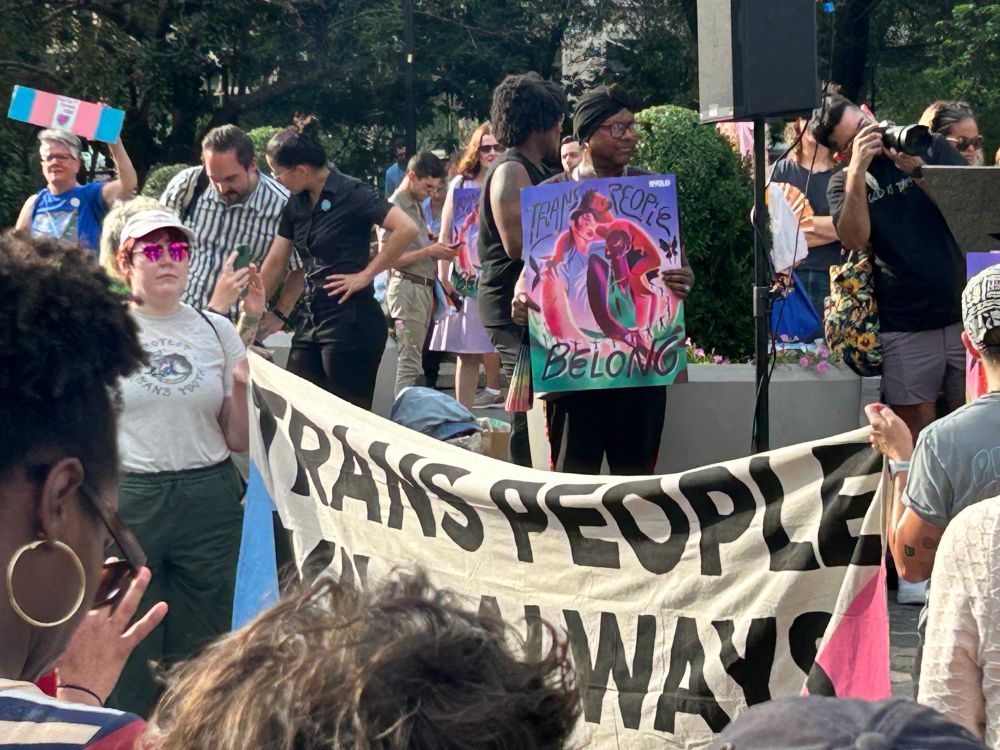 Trans rights demonstration in Union Square with sign saying "Trans People are Always Here."