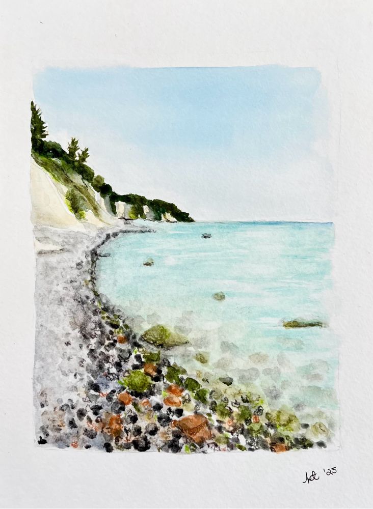 Watercolor painting of a shoreline with green algae covered rocks by the water 