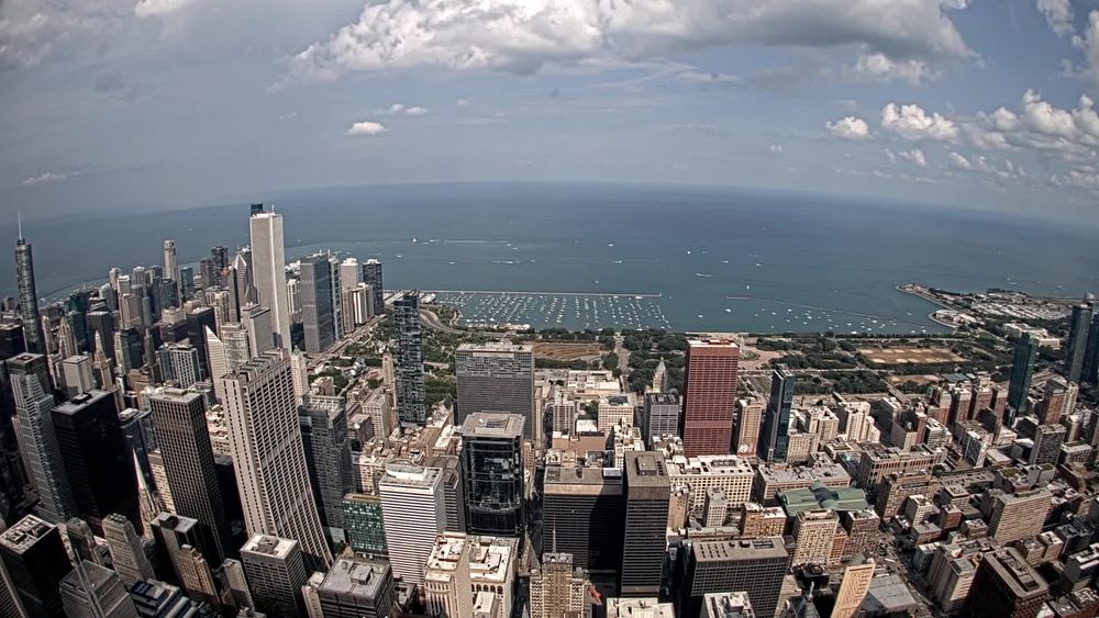 View looking east from the Skydeck at top of the Sears Tower towering over the Loop, Millenium Park, Chicago Harbor and Lake Michigan. // Image captured at: 2025-08-10 21:06:16 UTC (about 1 min. prior to this post) // Current Temp in Chicago: 87.45 F | 30.81 C // Precip: broken clouds // Wind: S at 13.802 mph | 22.21 kph // Humidity: 64%