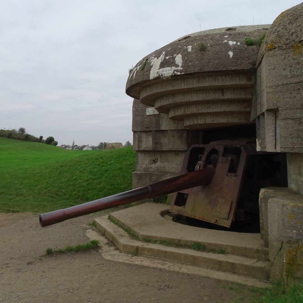 A concrete casemate from WW2 housing a large artillery gun