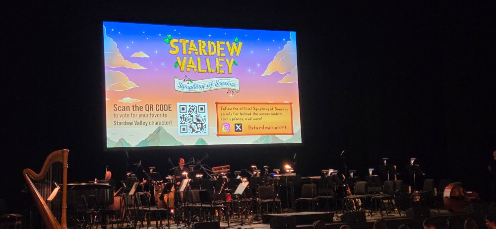 A picture of an orchestra and a screen showing Stardew Valley.