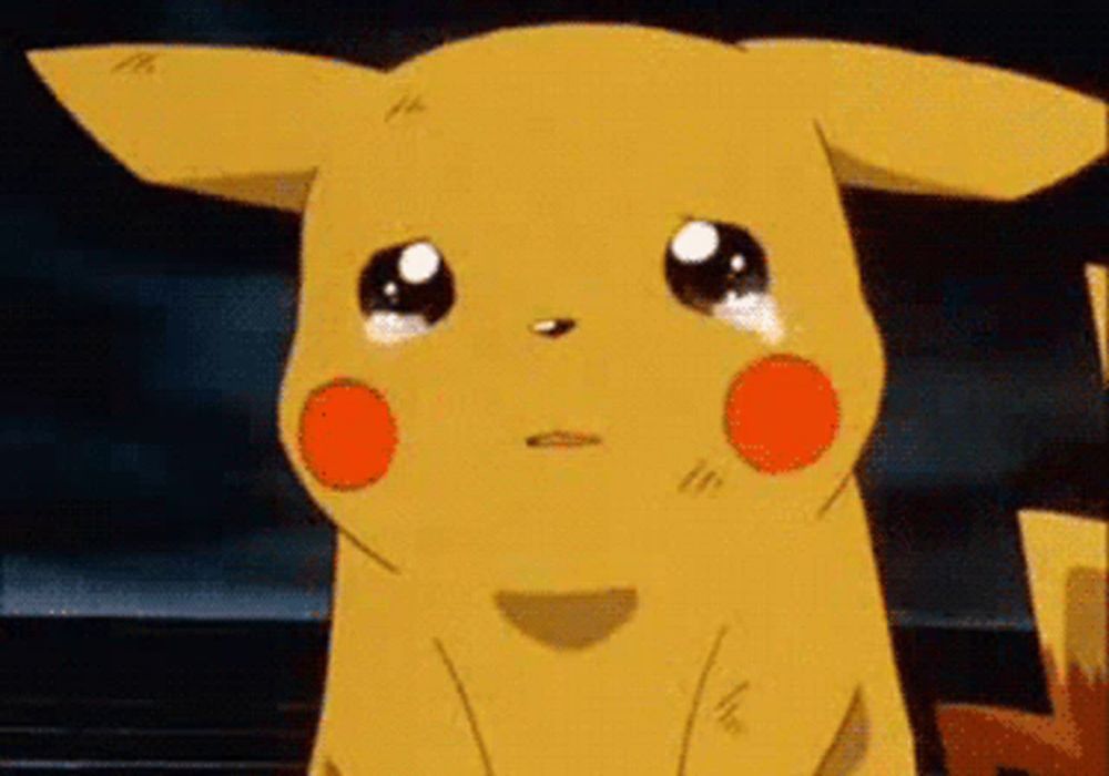 a close up of a cartoon pikachu crying with tears running down its face .