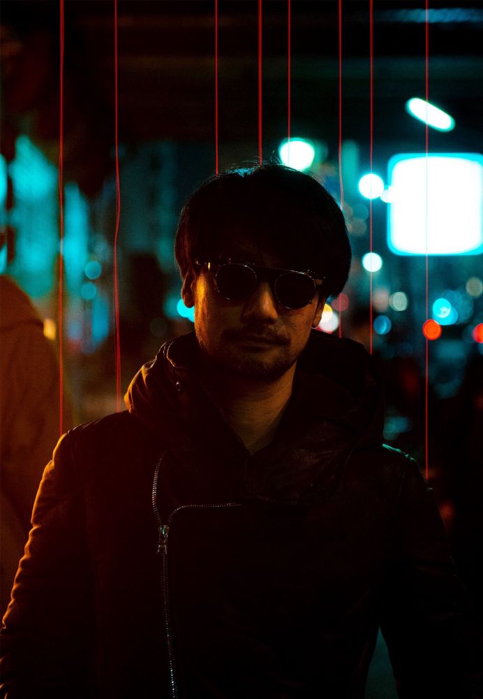 Photograph of game creator Hideo Kojima. He’s wearing stylish sunglasses at night. Director of Death Stranding, Metal Gear Solid, Snatcher. #gaming #videogames