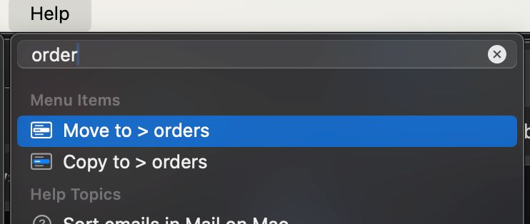 Revealing the Help menu and typing part of a mailbox name brings up the Move to > command.