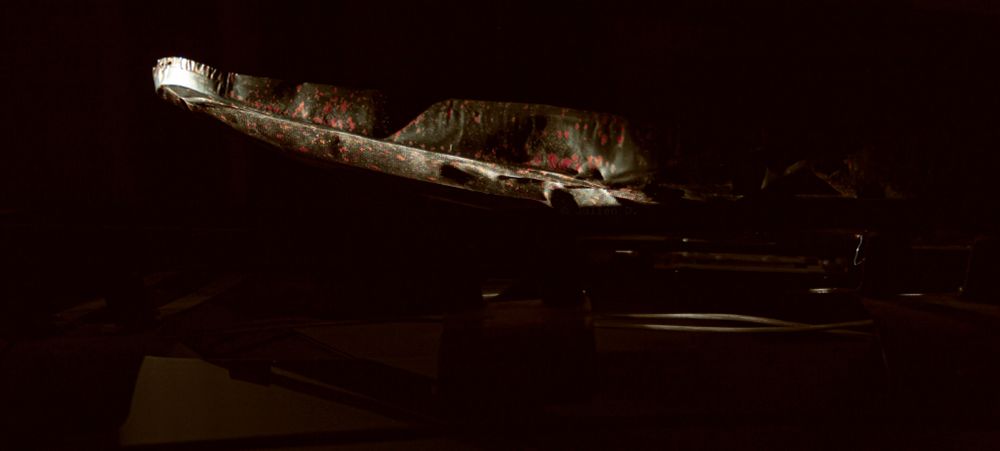 sunlight coming through a round hole, then bounced onto an early 1900s mirror onto the side of a bare phosphor mask of a CRT