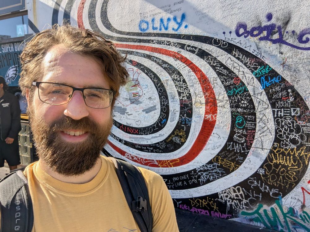 Selfie at the wall from the cover of Elliott Smith's Figure 8 album.