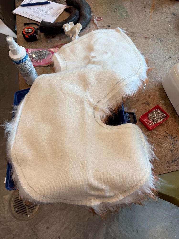 An inside out long curvy tail, pinned and ready to be sewn together
