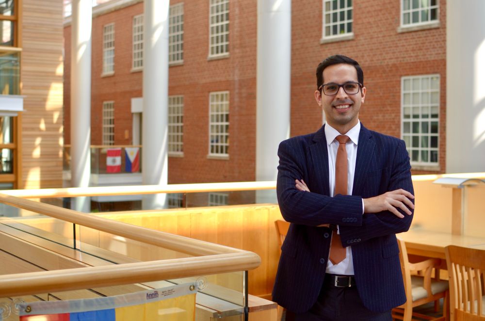 Picture of man dressed in a suit with his arms crossed