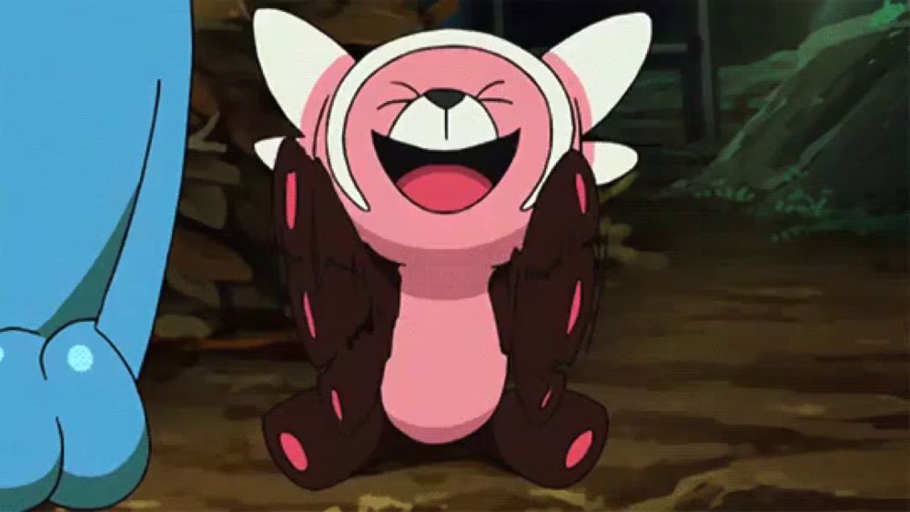 a pink and white cartoon character is laughing with its eyes closed