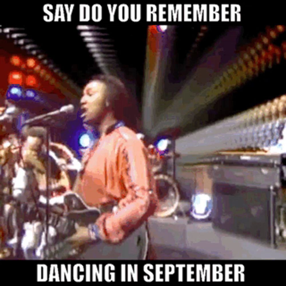 a man singing into a microphone with the words say do you remember dancing in september on the bottom