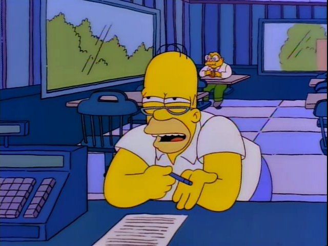 Homer at the IRS Burger with his reading glasses, trying to calculate... something
