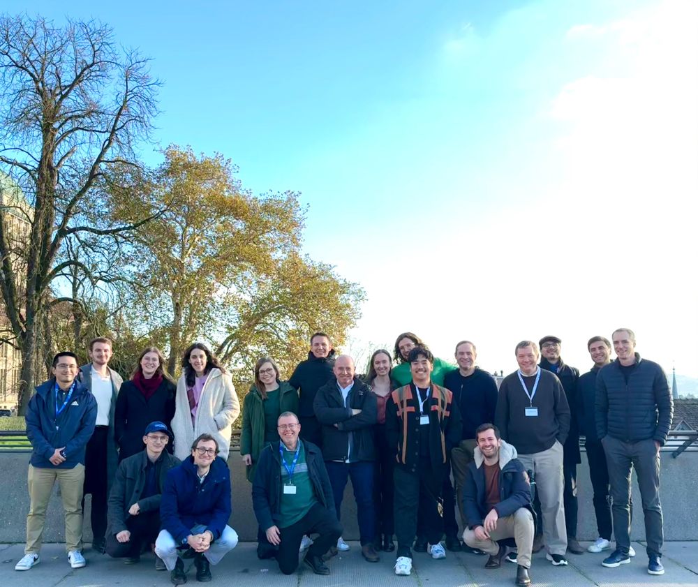 participants on a beautiful day in zurich, with on the left the UZH building