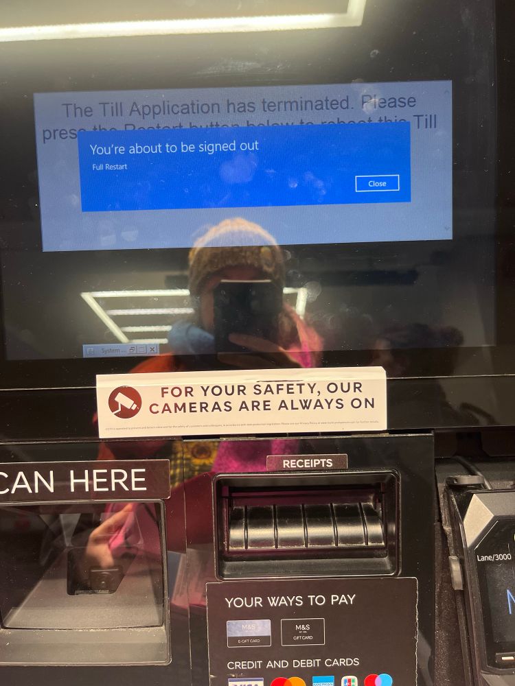 Photo of a self check out till with blue square saying “you’re about to be signed out”