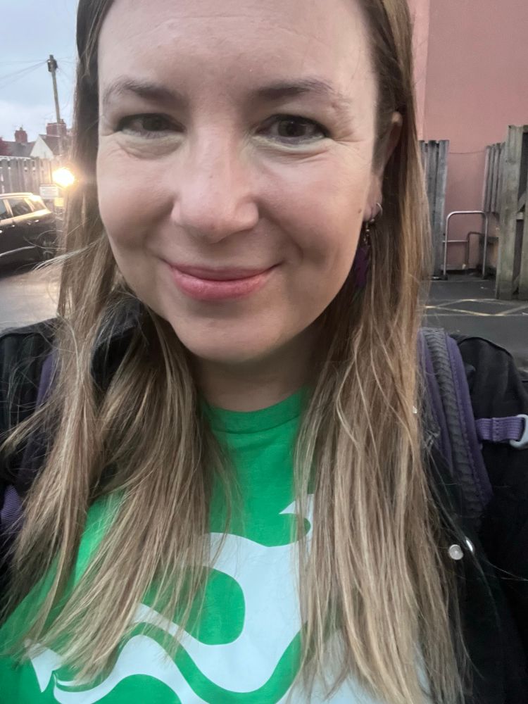 Smiling lady with green t shirt 