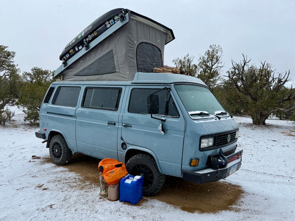Out lovely 1991 VW Vangon silhouetted in a light dusting of springtime snow somewhere in the desert of Utah 
