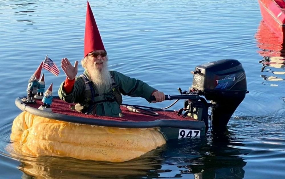 gnome in a hollowed out pumpkin with a motor on it