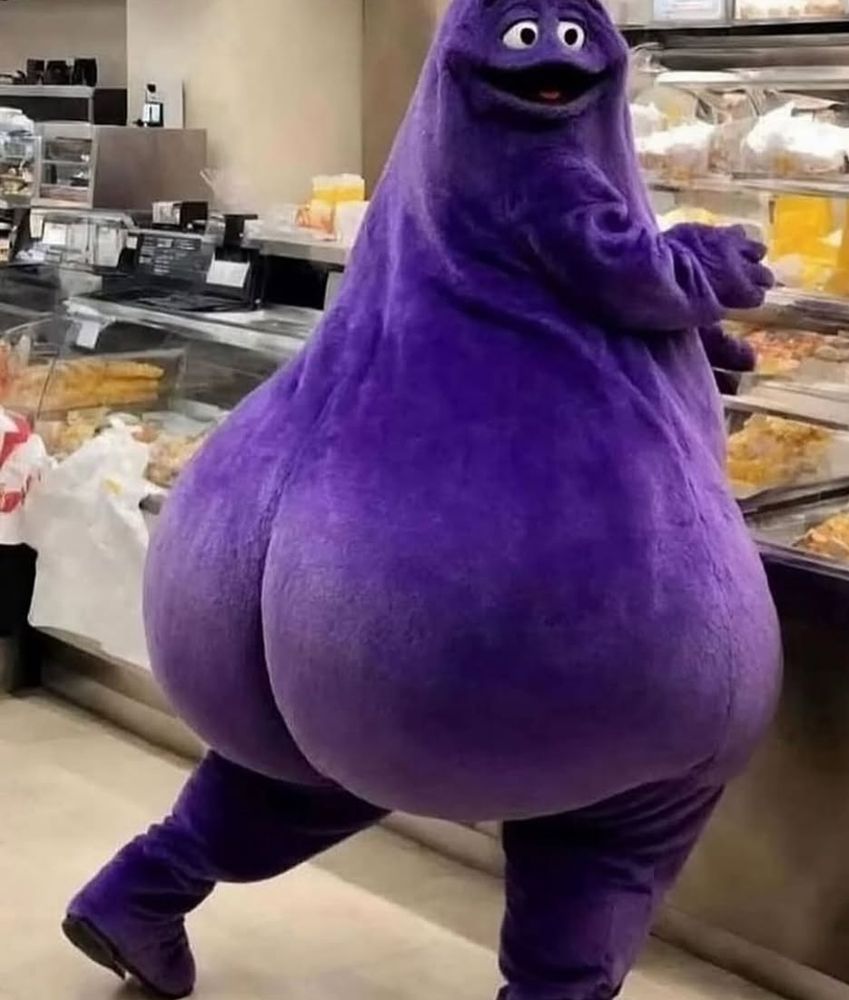 somebody in a grimace costume with a huge ol butt