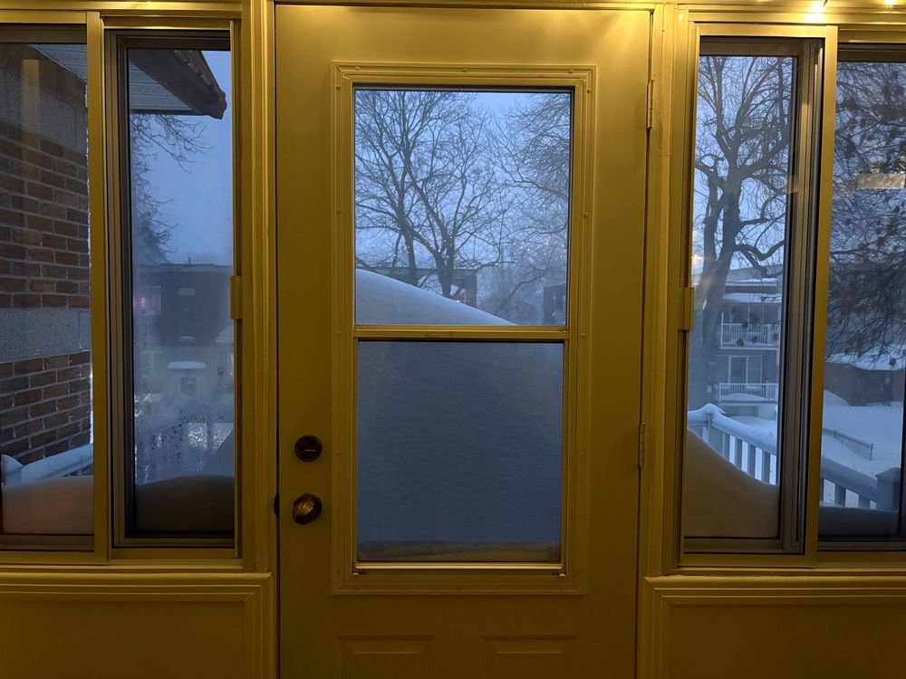 over a meter of snow on a balcony