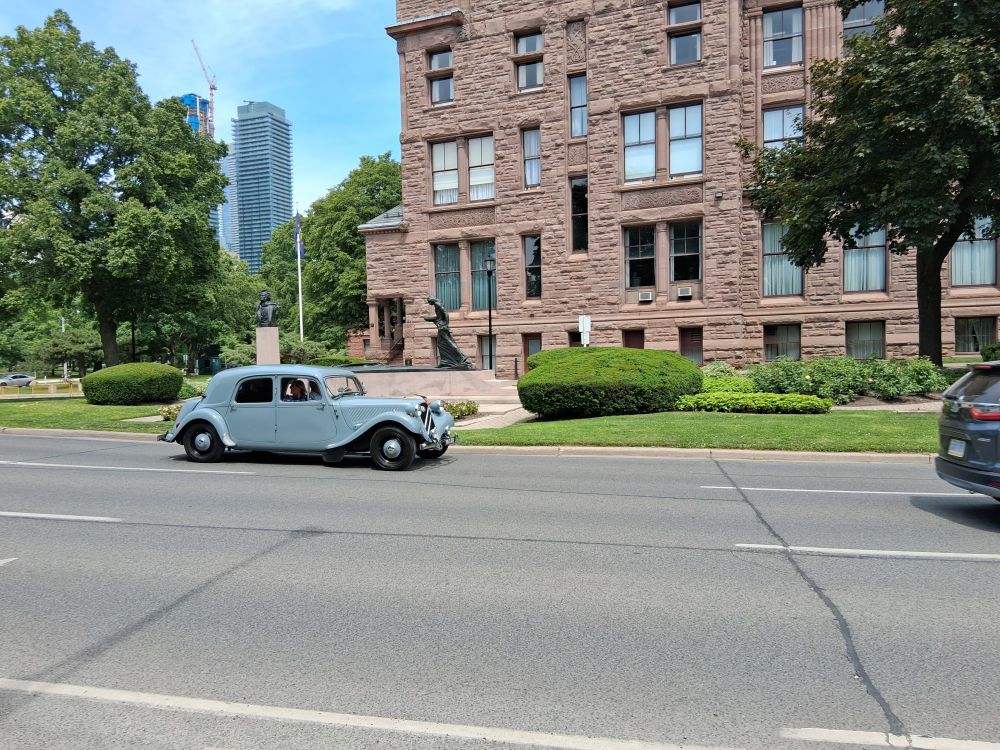 A grey Citroen Traction Avant at the north western corner of Queen's Park in Toronto