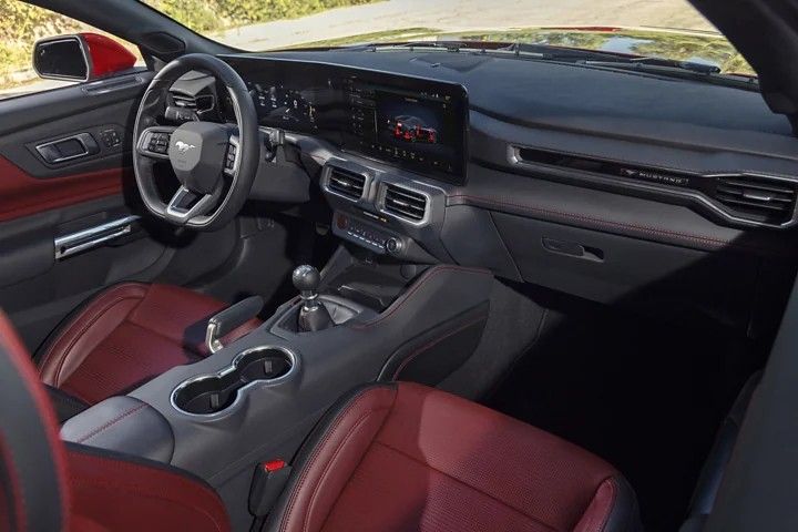 Interior of a 2025 Mustang with red seats