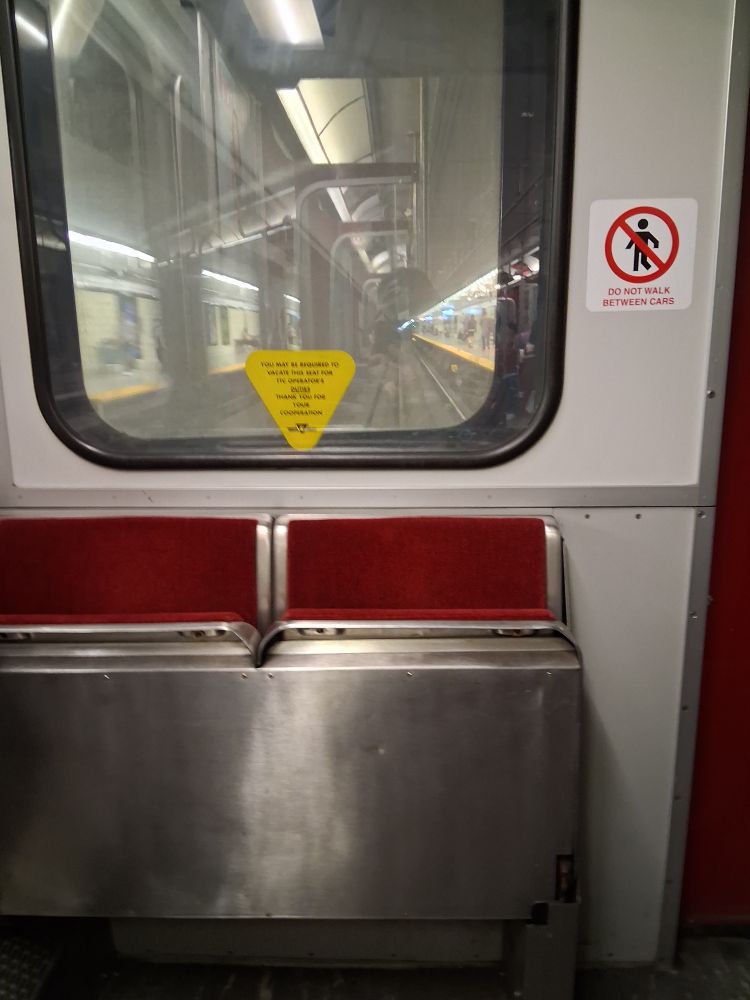 Looking out the front window of a TTC subway on the Bloor line, pulling into the statio.