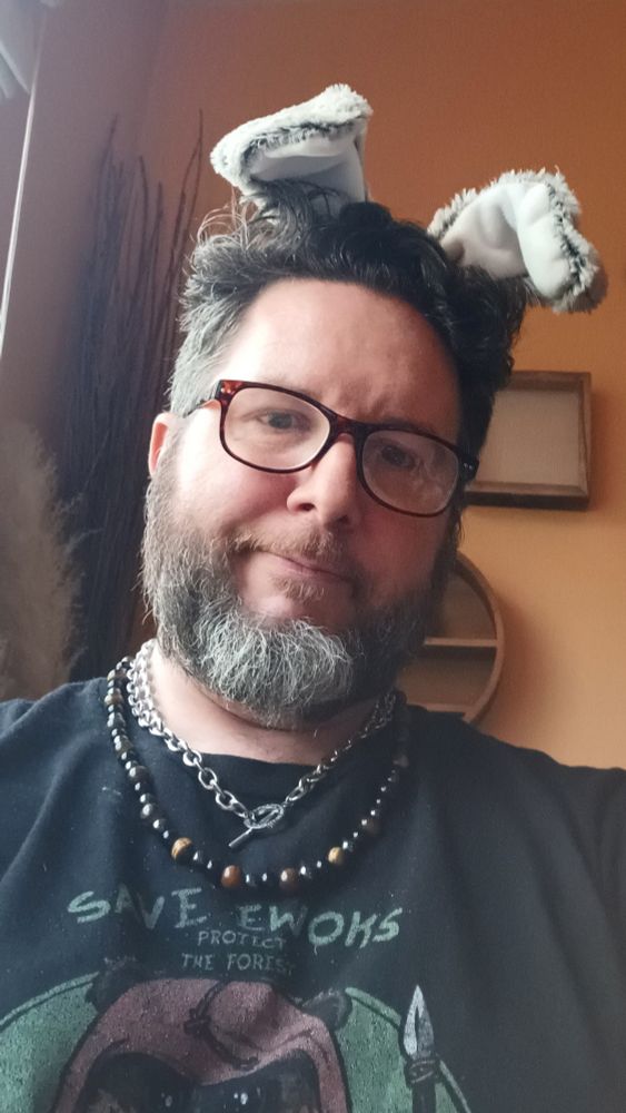 Dust-Bunny in ears & Save Ewoks T-shirt with gemstone jewelry and chain. 