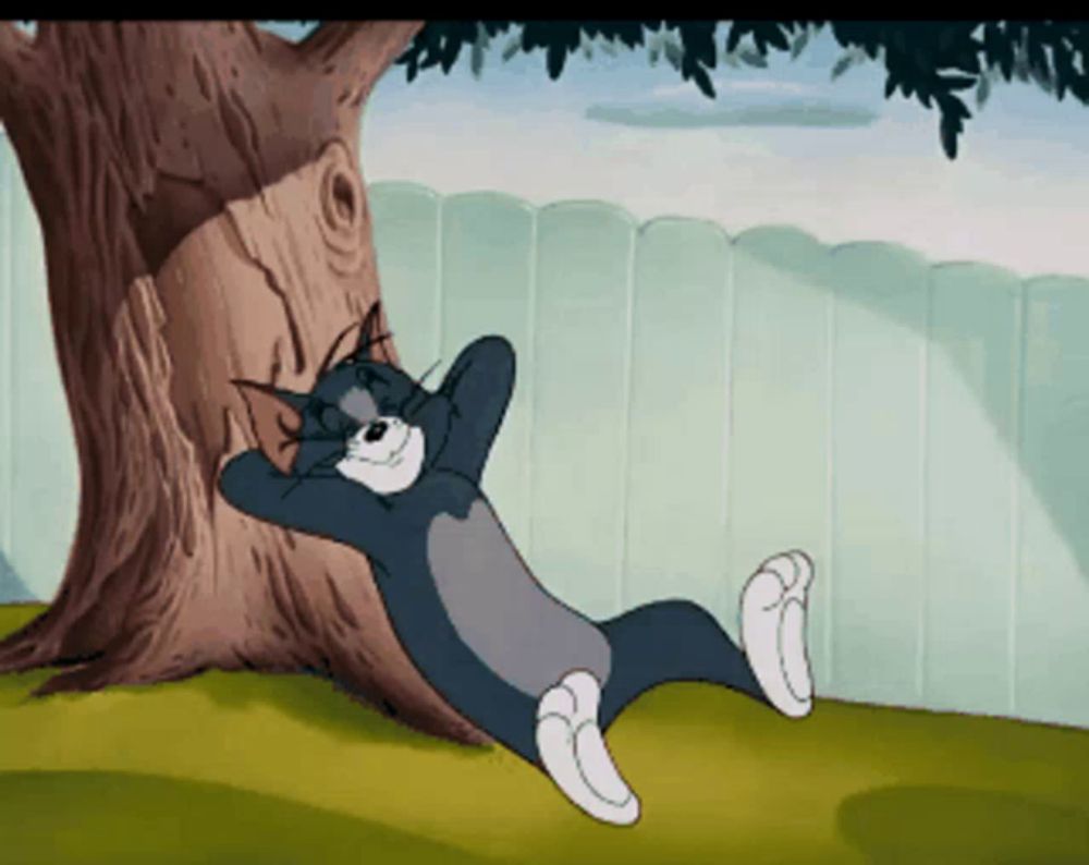 a cartoon cat laying under a tree with his hands behind his head