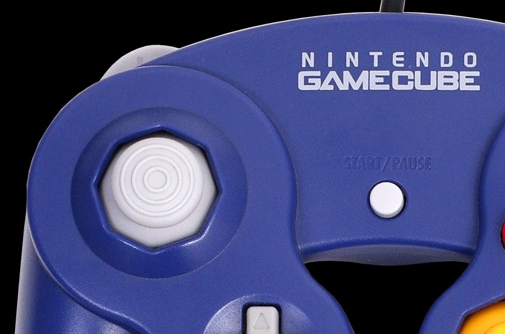 Nintendo GameCube controller, with the left-stick being focused on.