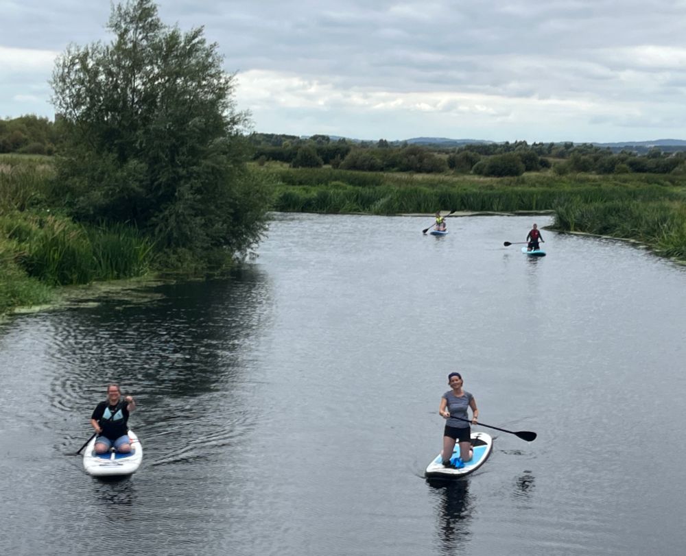 Catherine with friends 8 family on their paddle boards.