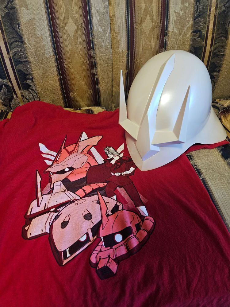 A T-shirt of Char and his mobile suits, and a life-size Char helmet 