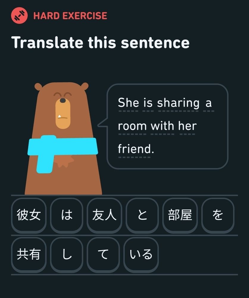 Duolingo Japanese lesson screenshot: "She is sharing a room with her friend".